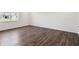 Bright bedroom with hardwood floors, white walls and a window showing lots of natural light at 6286 Wasco Dr, Whitestown, IN 46075