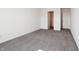 This bedroom features neutral carpeting and a walk-in closet at 6286 Wasco Dr, Whitestown, IN 46075
