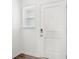 Clean and modern interior shot featuring the white front door and adjacent window at 6286 Wasco Dr, Whitestown, IN 46075