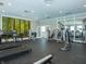 State-of-the-art fitness center with various equipment and forest-themed wall art at 6286 Wasco Dr, Whitestown, IN 46075