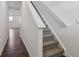 Bright hallway and staircase featuring new carpet and fresh, neutral paint at 6286 Wasco Dr, Whitestown, IN 46075