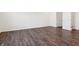 Bright living room features wood-look floors and white walls at 6286 Wasco Dr, Whitestown, IN 46075