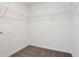 A bright walk-in closet features wire shelving, neutral carpet, and ample storage space at 6286 Wasco Dr, Whitestown, IN 46075