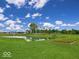 Scenic pond with lush landscaping and a grassy area at 6296 Wasco Dr, Whitestown, IN 46075