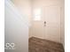 Bright entryway featuring wood flooring, white door and window, creating a welcoming atmosphere at 6296 Wasco Dr, Whitestown, IN 46075