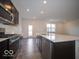 This kitchen is equipped with stainless steel appliances and features a spacious island at 6296 Wasco Dr, Whitestown, IN 46075
