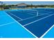 Modern pickleball court with blue surface and net at 6296 Wasco Dr, Whitestown, IN 46075