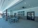 Covered patio area with tables and chairs near the pool at 6296 Wasco Dr, Whitestown, IN 46075