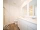 Bright bathroom featuring a double sink vanity with white cabinets and quartz countertops at 6304 Wasco Dr, Whitestown, IN 46075
