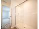 Shower with glass doors next to entryway with a light gray carpet at 6304 Wasco Dr, Whitestown, IN 46075