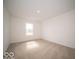 Bright, carpeted bedroom with window allowing natural light at 6304 Wasco Dr, Whitestown, IN 46075