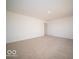 Large bedroom featuring neutral carpet and view to hallway at 6304 Wasco Dr, Whitestown, IN 46075