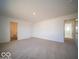 Large bedroom featuring neutral carpet and view to bathroom at 6304 Wasco Dr, Whitestown, IN 46075