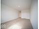 Bright, carpeted bedroom with neutral carpet and a door at 6304 Wasco Dr, Whitestown, IN 46075
