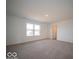 Spacious bedroom with neutral carpet, large window and a view at 6304 Wasco Dr, Whitestown, IN 46075