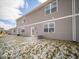Back of home showcasing gray siding, windows, and a small patio space at 6304 Wasco Dr, Whitestown, IN 46075