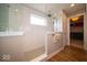 Modern bathroom showcasing a glass-enclosed shower with white subway tile and a convenient towel rack at 1220 Greenwood Station Blvd, Greenwood, IN 46143