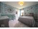 Comfortable bedroom featuring decorated walls, closet and a large bed at 1220 Greenwood Station Blvd, Greenwood, IN 46143