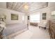 Comfortable bedroom with decorative ceiling and a large bed at 1220 Greenwood Station Blvd, Greenwood, IN 46143