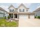 Beautiful two-story home with a brick-accented facade and attached two car garage at 1220 Greenwood Station Blvd, Greenwood, IN 46143