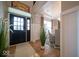 Bright foyer boasts hardwood floors and high ceilings with views of the dining area at 1220 Greenwood Station Blvd, Greenwood, IN 46143