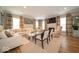 Spacious living room with hardwood floors, neutral paint, and a fireplace with television above at 1220 Greenwood Station Blvd, Greenwood, IN 46143