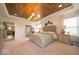Bright main bedroom boasts a decorative ceiling and a large window at 1220 Greenwood Station Blvd, Greenwood, IN 46143