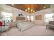 Bright main bedroom boasts a decorative ceiling and a large window at 1220 Greenwood Station Blvd, Greenwood, IN 46143