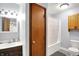 This updated bathroom features a shower-tub combo, modern vanity, and matching fixtures at 2747 E Midland Rd, Indianapolis, IN 46227