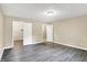 Spacious bedroom with neutral paint, luxury vinyl plank flooring, a closet and an ensuite at 2747 E Midland Rd, Indianapolis, IN 46227