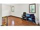 Bright bedroom with hardwood flooring, two windows, and ample space for furniture or play area at 2747 E Midland Rd, Indianapolis, IN 46227