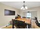 Cozy dining space with hardwood floors, a wooden table, and a decorative sign at 2747 E Midland Rd, Indianapolis, IN 46227