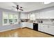 Charming kitchen featuring white cabinets, stainless sink, and bright window at 2747 E Midland Rd, Indianapolis, IN 46227