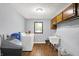 Bright laundry room with washer, dryer, utility sink, and storage, offering convenience at 2747 E Midland Rd, Indianapolis, IN 46227