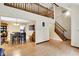 Spacious open-plan living area featuring a staircase, and dining space, all with hardwood flooring at 2747 E Midland Rd, Indianapolis, IN 46227