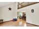 Open concept living area with high ceilings, hardwood floors, and views into the dining area at 2747 E Midland Rd, Indianapolis, IN 46227