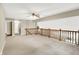 The open-concept living room includes a wood banister overlooking a staircase at 2747 E Midland Rd, Indianapolis, IN 46227