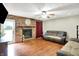 Cozy living room featuring a brick fireplace and comfortable sofa at 2747 E Midland Rd, Indianapolis, IN 46227