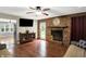 Bright living room featuring a brick fireplace at 2747 E Midland Rd, Indianapolis, IN 46227