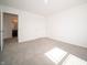 Bedroom with neutral carpet, white walls, entry to bathroom and walk-in closet at 6314 Wasco Dr, Whitestown, IN 46075