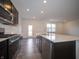 Modern kitchen with stainless steel appliances and white countertop island and sink at 6314 Wasco Dr, Whitestown, IN 46075