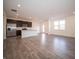 Open concept kitchen with stainless steel appliances and island with a breakfast bar at 6314 Wasco Dr, Whitestown, IN 46075