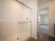 Bright bathroom featuring stand up shower with sliding door and light gray flooring at 6314 Wasco Dr, Whitestown, IN 46075