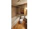 Bathroom featuring a tiled shower and tub combination and rustic wood vanity at 8855 N Waverly Park Rd, Martinsville, IN 46151