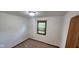 Bedroom with carpeted floors and a window with neutral paint at 8855 N Waverly Park Rd, Martinsville, IN 46151