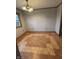 The dining room features parquet floors and a chandelier with a window at 8855 N Waverly Park Rd, Martinsville, IN 46151