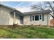 Charming single story home features a blue front door, blue shutters, and landscaped garden beds at 8855 N Waverly Park Rd, Martinsville, IN 46151