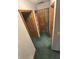 Hallway with green carpet and multiple doorways leading to different rooms at 8855 N Waverly Park Rd, Martinsville, IN 46151
