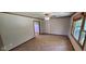 This cozy living room features neutral carpet, light-gray walls, wood trim, and natural light at 8855 N Waverly Park Rd, Martinsville, IN 46151