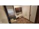 Functional utility room with vinyl floors, cabinet storage, and plumbing and electrical hookups at 8855 N Waverly Park Rd, Martinsville, IN 46151
